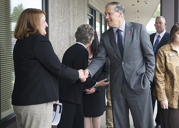 Gov. Jay Inslee greets Green River Community College staff during his visit Tuesday in Kent.