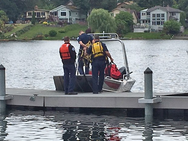 Divers search for a missing man presumed drown in SeaTac's Angle Lake on Saturday afternoon.