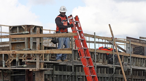 Crews work to construct the Kent Station Apartments on Wednesday along Fourth Avenue North. Tarragon expects to complete the 154 units by spring 2016.