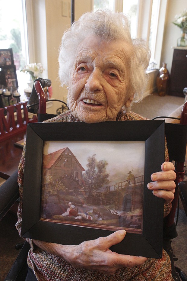 Irma Morrison shows one of her oil paintings.