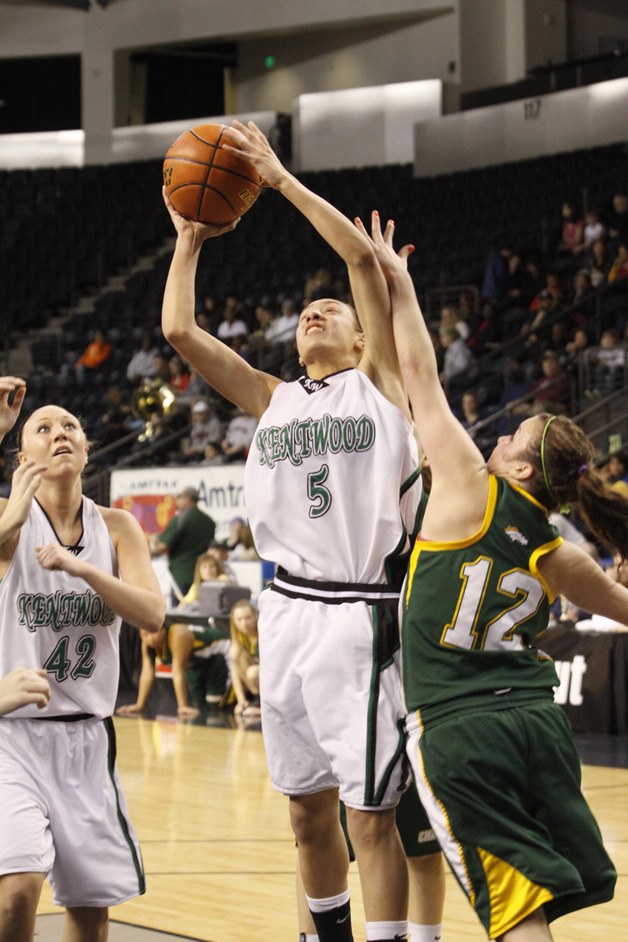 Kentwood’s Sarah Toeaina drives against a Kentridge defender in a game last season. She is one of seven sophomores playing for the Conquerors this year.