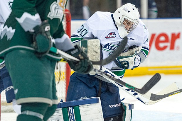 Thunderbirds goalie Landon Bow makes of his 23 saves in the playoff win Sunday night.