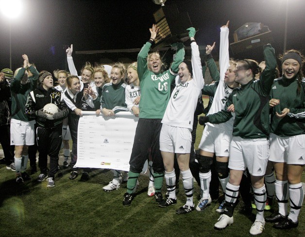 11/20/10 Kentwood girls soccer team celebrates with the 4A State Soccer Trophy Saturday