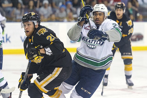 The Thunderbirds' Keegan Kolesar battles the Wheat Kings' Macoy Erkamps during WHL finals play Tuesday night.