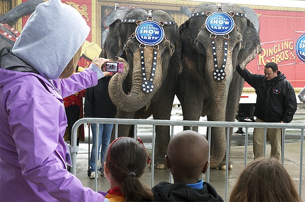 Children from the Kent Youth and Family Services line up outside the ShoWare Center to get a look at Carole and Patty