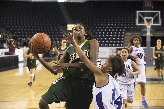 Kentridge’s Taylor Jenkins drives to the basket during a win against Kent-Meridian on Jan. 29 at the ShoWare Center.