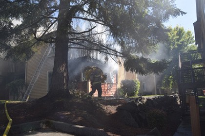 Firefighters contain a two-alarm apartment complex fire in Kent on Monday