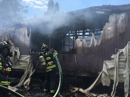 Kent firefighters put out a fire that damaged a mobile home on Sunday. No one was inside the home