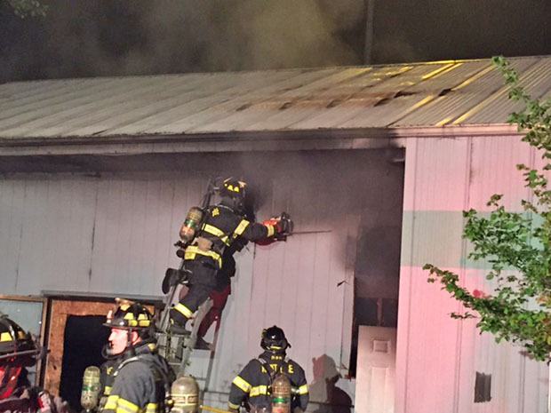 Kent firefighters extinguished an abandoned warehouse fire in Kent on Sunday night.