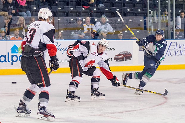 The T-Birds' Ryan Gropp fires a shot past the Warriors' Jiri Smejkal