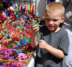 Cody Beaver looks at bead color animals at the 2013 Kent Cornucopia Days.