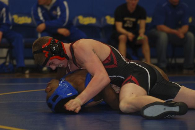 Kentlake’s Colton Marlowe pins Kent-Meridian’s Josh Smith in a double dual on Jan. 4 at Tahoma High.