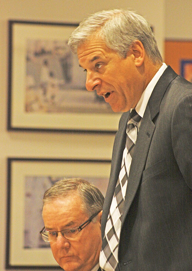 Defense attorney Gregory Girard talks to King County Superior Court Judge James Cayce