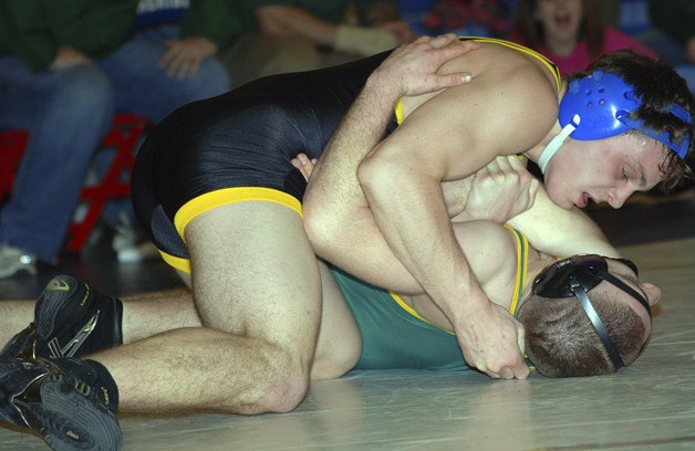 Tahoma’s Austin Perry works to earn near fall points against Auburn’s James West in the 182 pound final at the South Puget Sound League sub-regional wrestling tournament Feb. 4 at Kent-Meridian. Perry pinned west in the second period.