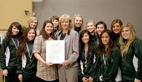 King County Councilwoman Julia Patterson stands with members of the Kentridge Chatelaines dance team May 10