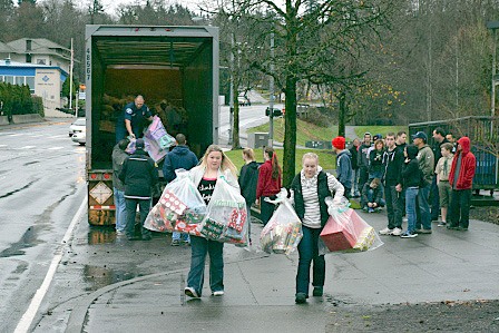 Volunteers deliver toys for the Kent Toys for Joy program that collected more than 4