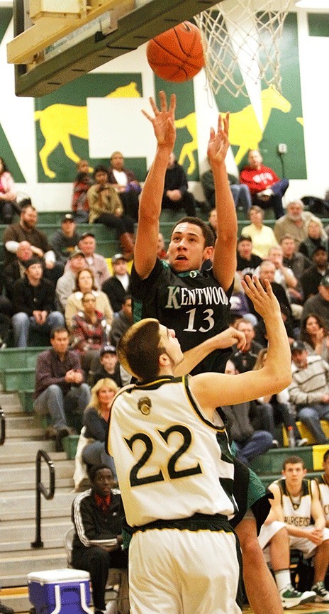 Kentwood's Taylor Jones goes to the basket for two of his team-high 17 points in Wednesday night's 75-62 win over Kentridge.