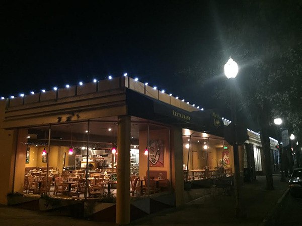 Roofline lighting adorns Wild Wheat Bakery in Downtown Kent.