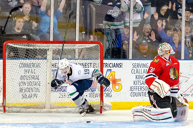 The Thunderbirds' Donovan Neuls fires the puck past Winterhawks goalie Adin Hill for what proved to be the decisive goal in the shootout Friday night.