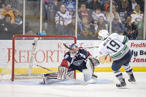 The Thunderbirds' Donovan Neuls rifles a goal past Tri-City keeper Evan Sarthou during WHL play Friday night.