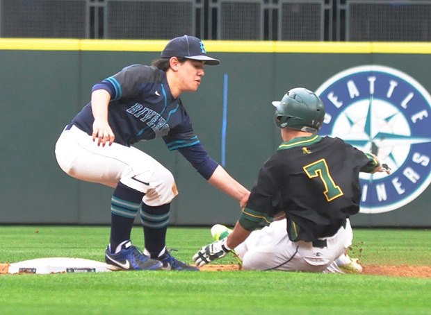 Auburn Riverside's Kenny Miller tags out Kentridge's Isaac Barrera at second base during nonleague action at Safeco Field on Saturday.