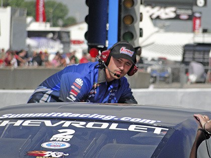 Dallas Glenn helps Jason Line’s Pro Stock car get ready for a run. Glenn