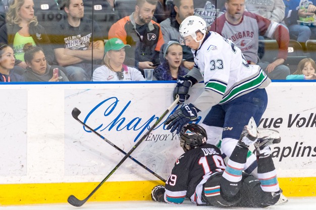 Seattle's Jared Hauf (33) goes for the puck in a recent WHL playoff game against Kelowna at the ShoWare Center.