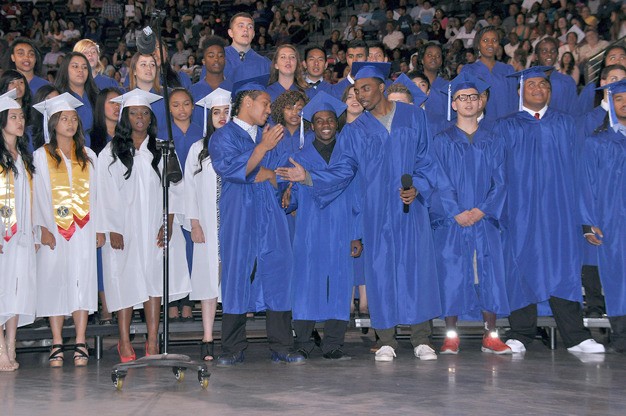 The Kent-Meridian High choir performs at last year's graduation at the ShoWare Center.