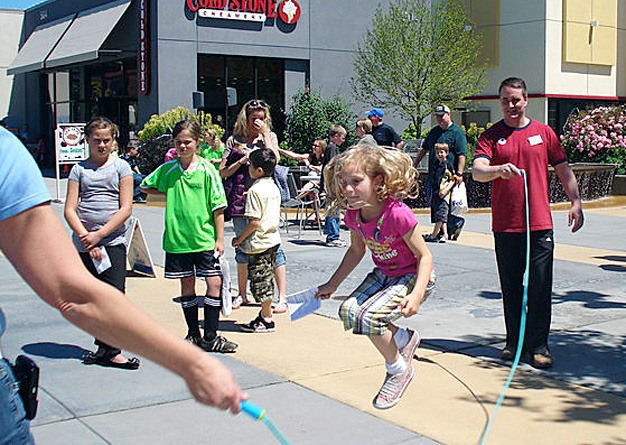 Children participate in the Cruzin’ Passport Summer Health Challenge last year at Kent Station. This year's event kicks off June 11.