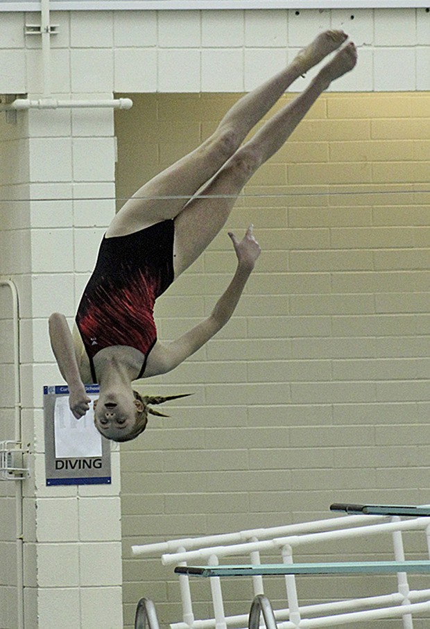 Kentlake sophomore Haley Pond performs a dive during the West Central District meet at the Curtis Aquatic Center at University Place on Thursday. Pond reached the semifinals in the 1-meter diving competition.