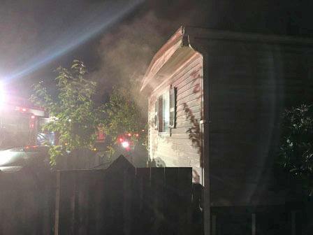 Firefighters converged to put out a fire that damaged a double-wide mobile home in Kent on Saturday night. No one was home at the time of the fire. COURTESY PHOTO