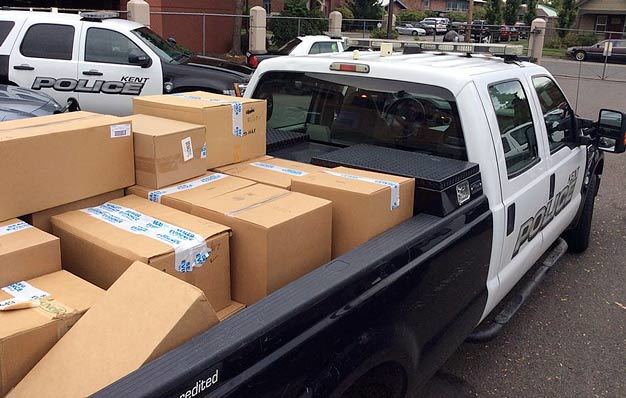 Staff packed up boxes of returned prescription drugs on Saturday at the Kent Police station during National Prescription Drug Take Back Day. Courtesy Photo