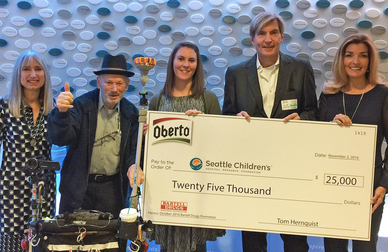 Representatives from Bartell Drugs and Oberto meet to present a $25,000 donation to Seattle Children’s Hospital Foundation officials. From left: Laura Oberto, Oberto board director; Art Oberto, patriarch and director emeritus; Evelyn Merrill, Bartell Drugs senior marketing manager-digital and fourth generation Bartell family member; Thomas Hernquist, CEO of Oberto; Michele Smith, board chair of Seattle Children’s Hospital and Research Foundation. COURTESY PHOTO