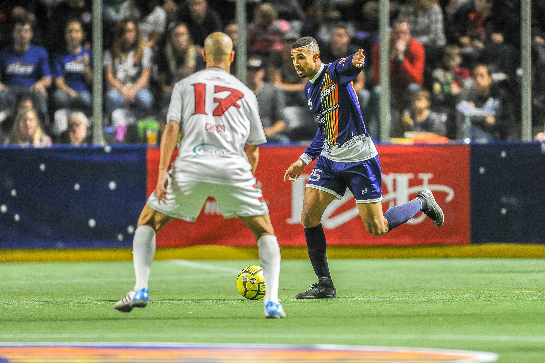 The Stars’ Michael Ramos dribbles the ball upfield against the Fury’s Andriy Budnyy during MASL play Saturday night at the ShoWare Center. Ramos scored two goals in the Stars’ 8-5 win. COURTESY PHOTO, Wilson Tsoi/Tacoma Stars