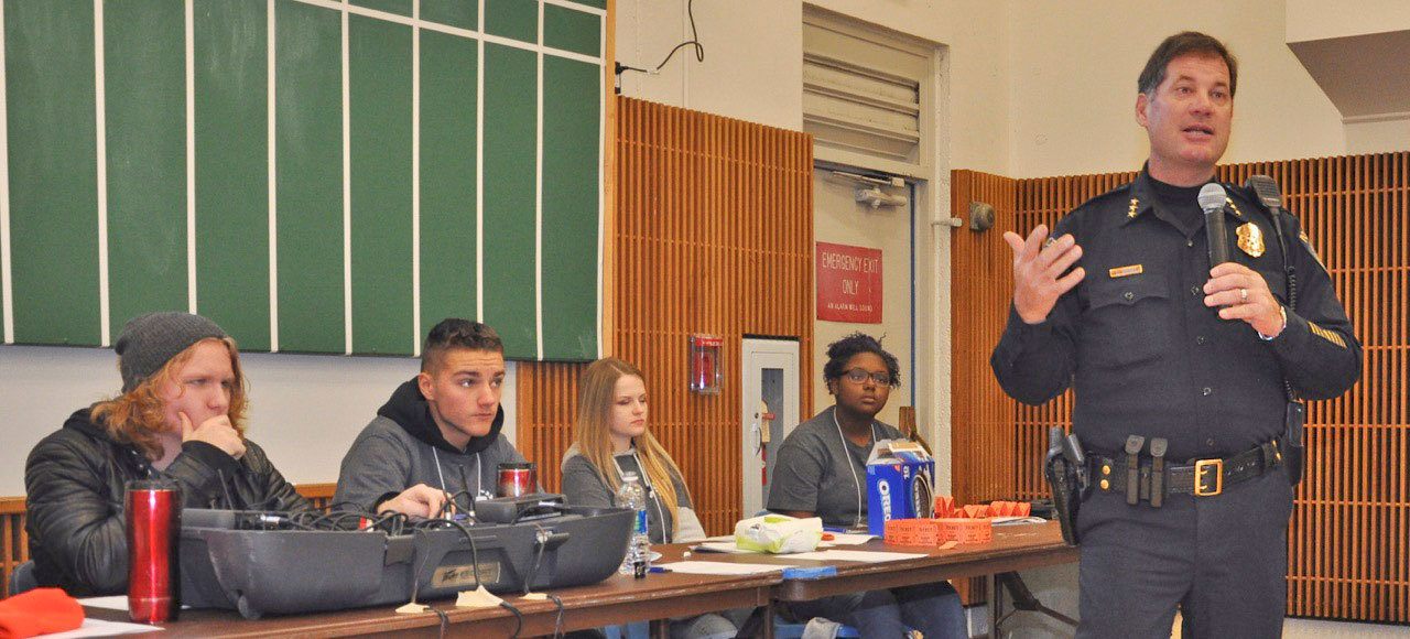 Kent Police Chief Ken Thomas talks to teenagers during the recent Game of Life Youth Conference at the Kent Commons. Behind Thomas are members of the Kent Police Youth Board, a group of diverse teens dedicated to community leadership who helped organize the Dec. 13-14 event with the support of the Kent Police Department. RACHEL CIAMPI, Reporter