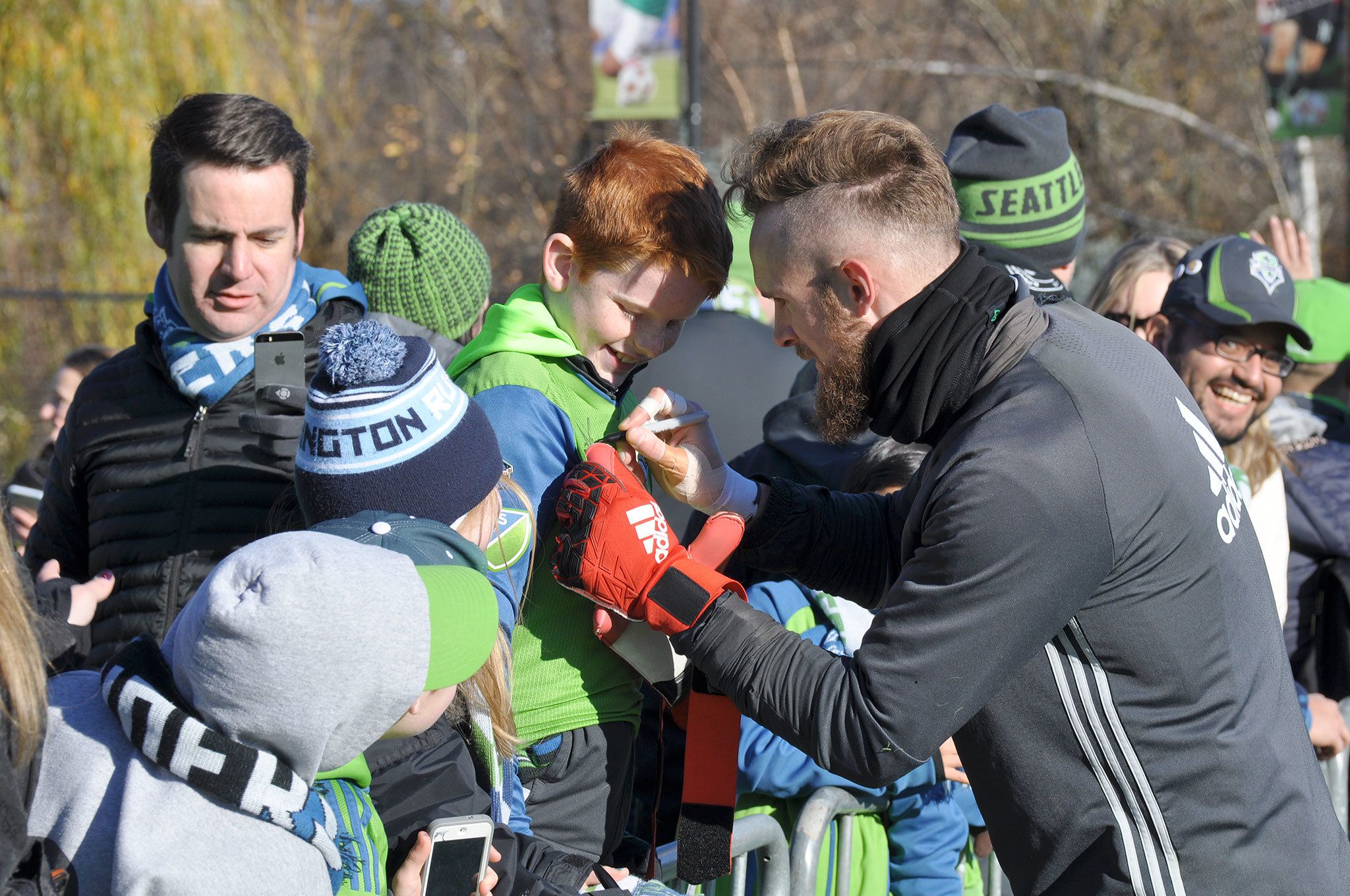 Seattle Sounders goalkeeper Stefan Frei signs a young fan’s jersey. HEIDI SANDERS/Tukwila Reporter