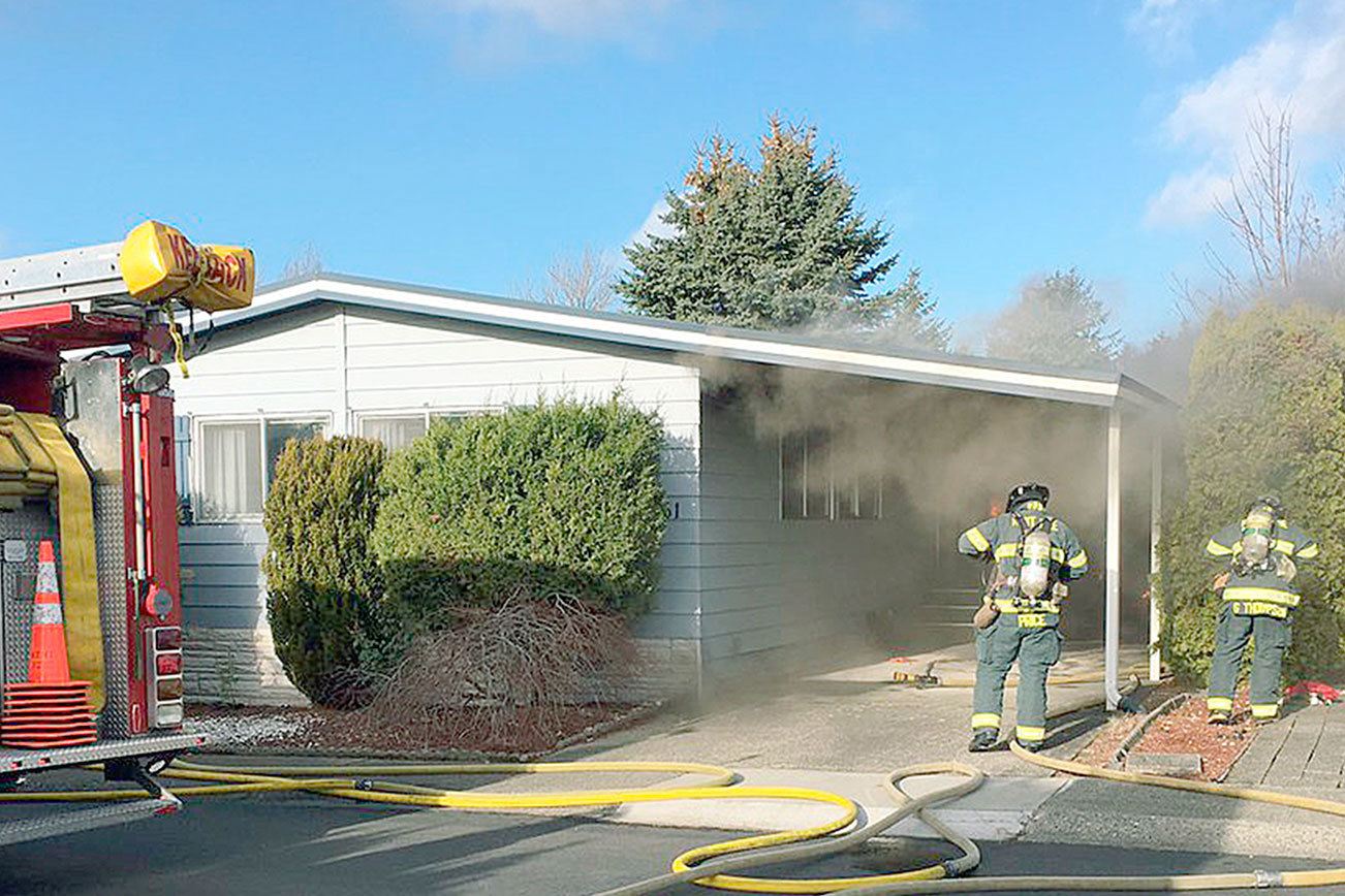 Firefighters battle Kent mobile home fire | Update