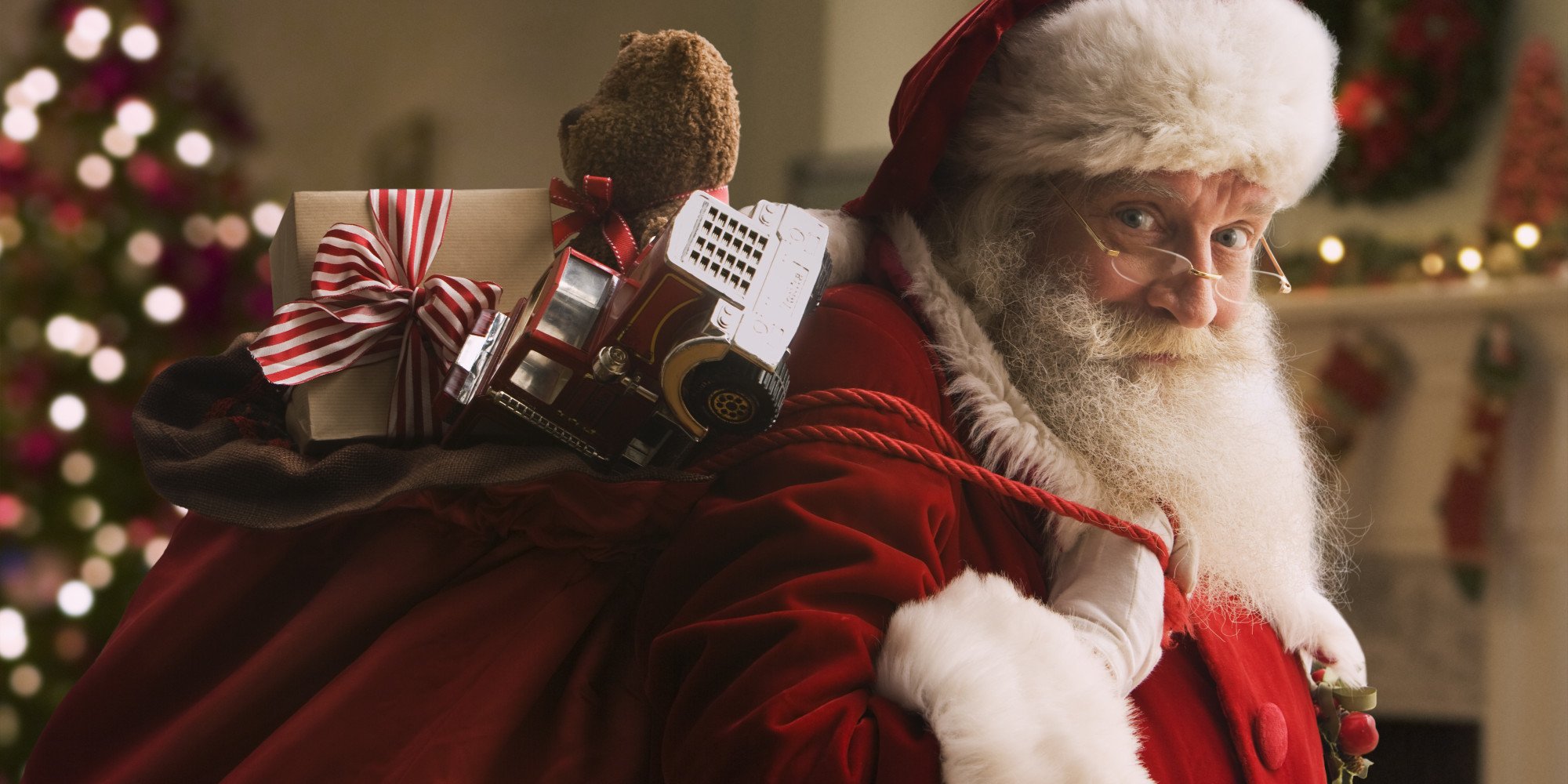 Santa sits for free pictures with families