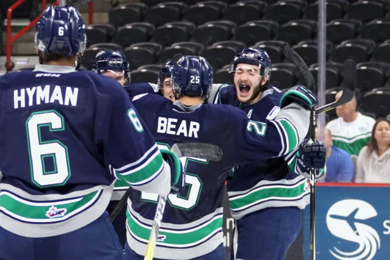 The Thunderbirds celebrate Austin Strand’s game-winning goal in overtime against the Chiefs on Tuesday night. COURTESY PHOTO, Larry Brunt