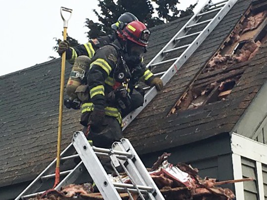 Firefighters extinguish Kent house fire