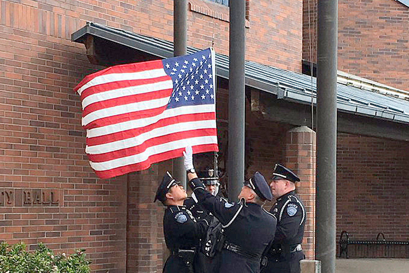 Kent Police Honor Guard flies flag for detective Focht