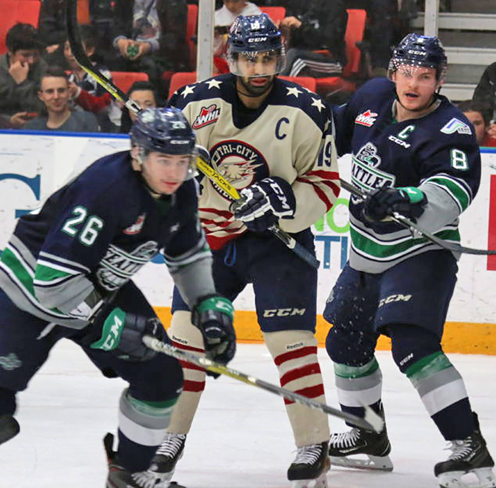 The Thunderbirds’ Nolan Volcan, left, pursues the puck as teammate Scott Eansor defends the Americans’ Tyer Sandhu during Game 4 action Friday night. COURTESY PHOTO, Judy Simpson