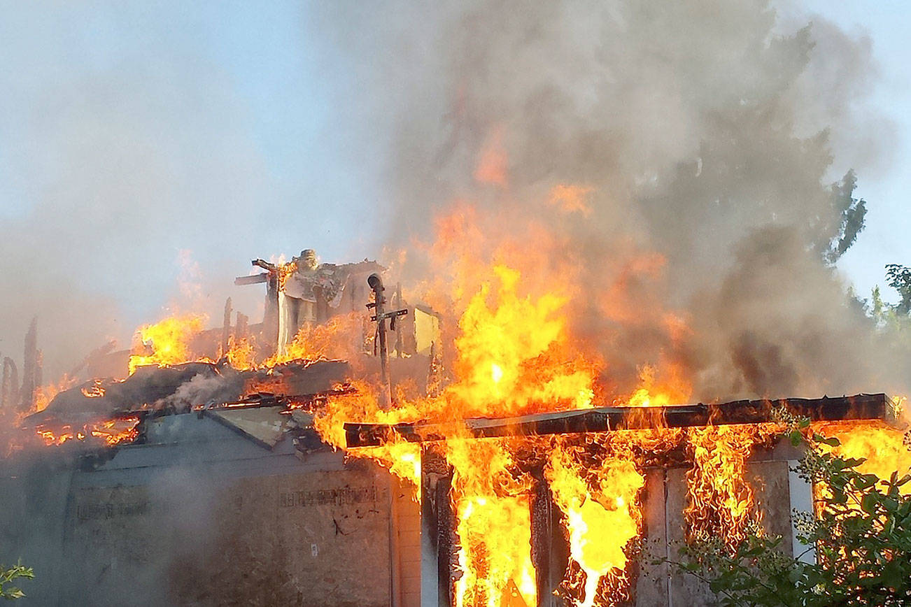 Kent firefighters extinguish fire at abandoned home on Russell Road