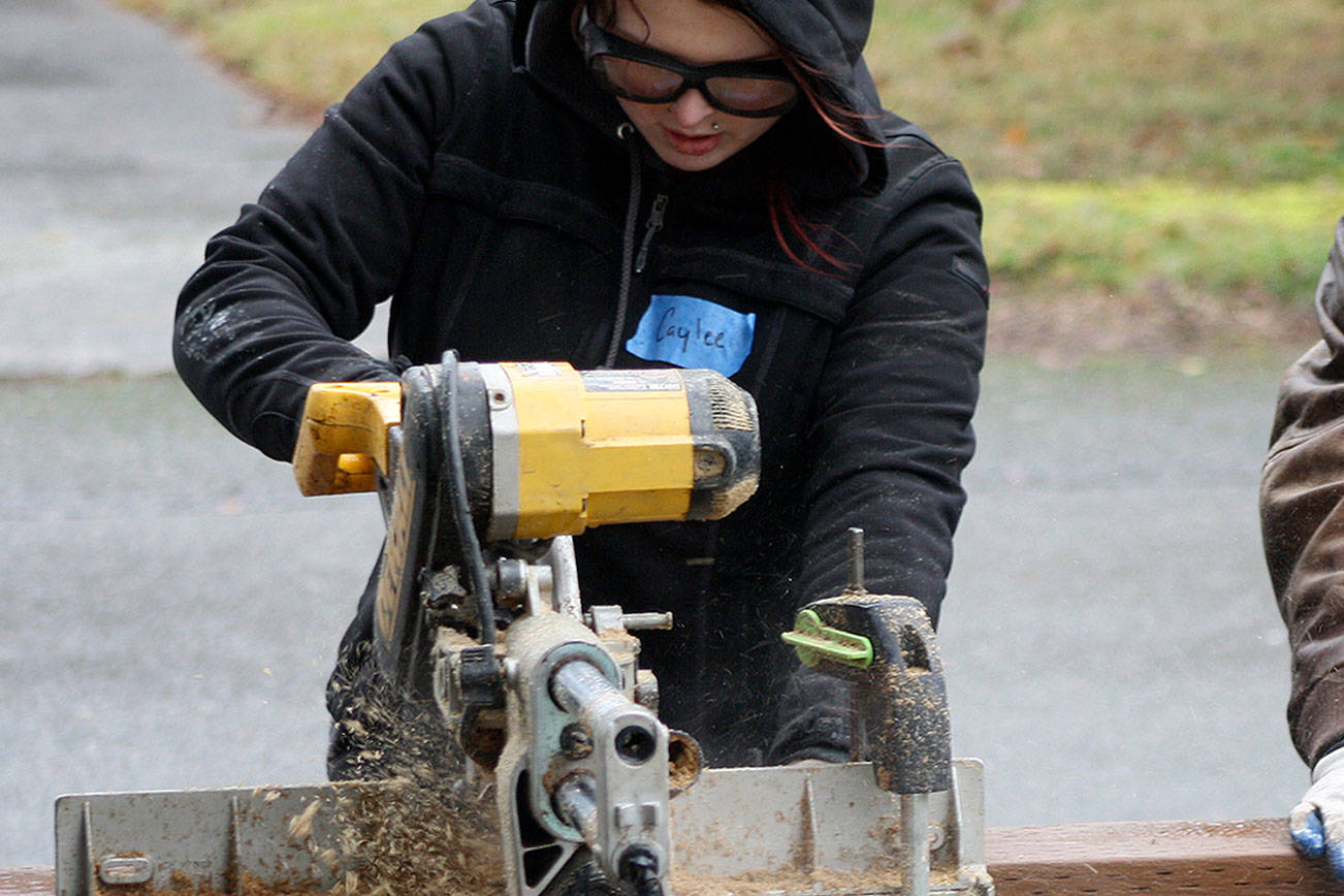 Volunteers help a Kent veteran with home repairs