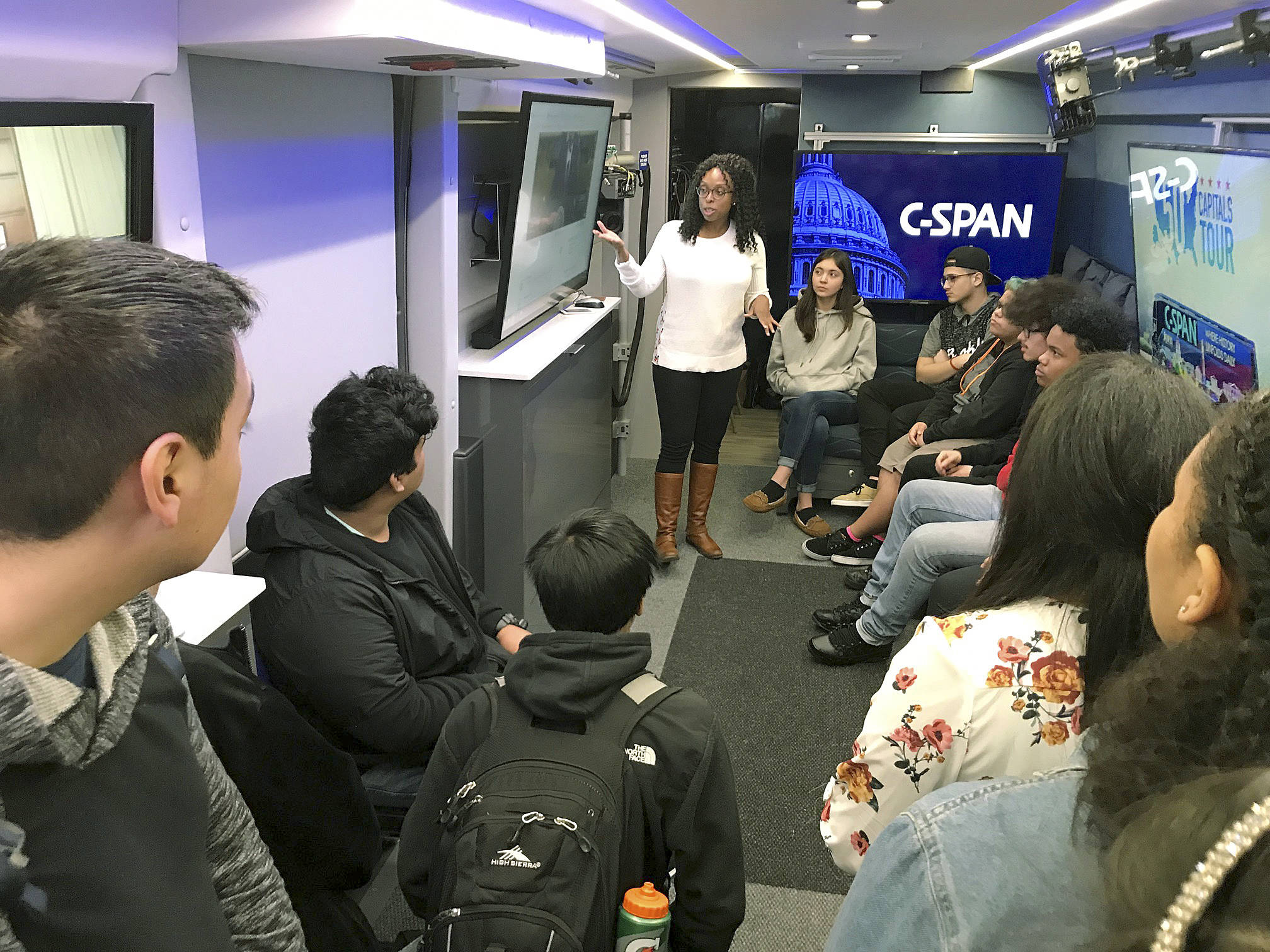 Shannon Augustus, a marketing representative for C-SPAN, engages students on a discussion on the touring bus. MARK KLAAS, Kent Reporter