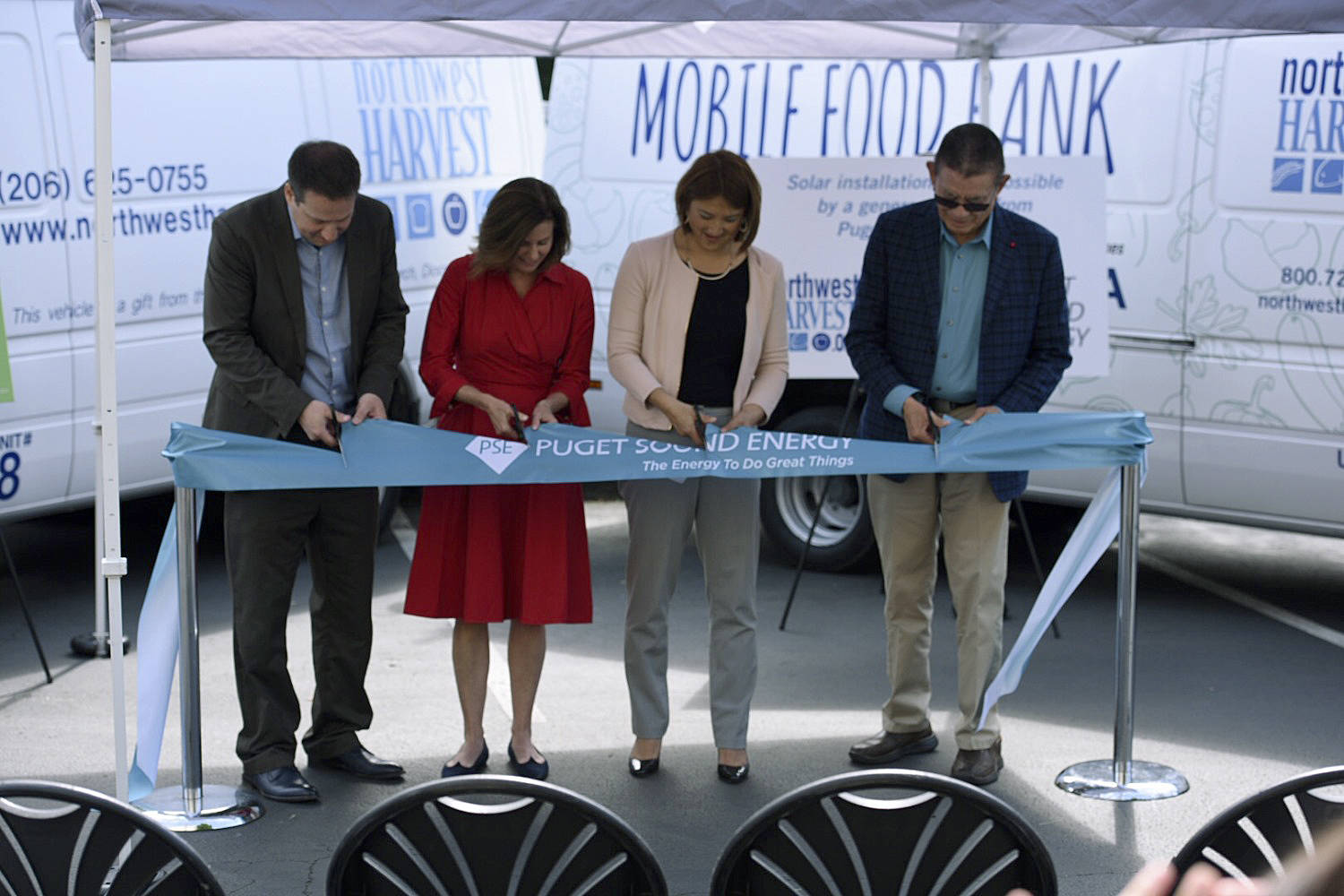 From Left: Thomas Reynolds, Northwest Harvest CEO; Kimberly Harris, Puget Sound Energy President and CEO; state Rep. Mia Gregerson, D-SeaTac; and state Sen. John McCoy, D-Tulalip, participate in a ribbon cutting ceremony at the Kent facility on June 5. COURTESY PHOTO