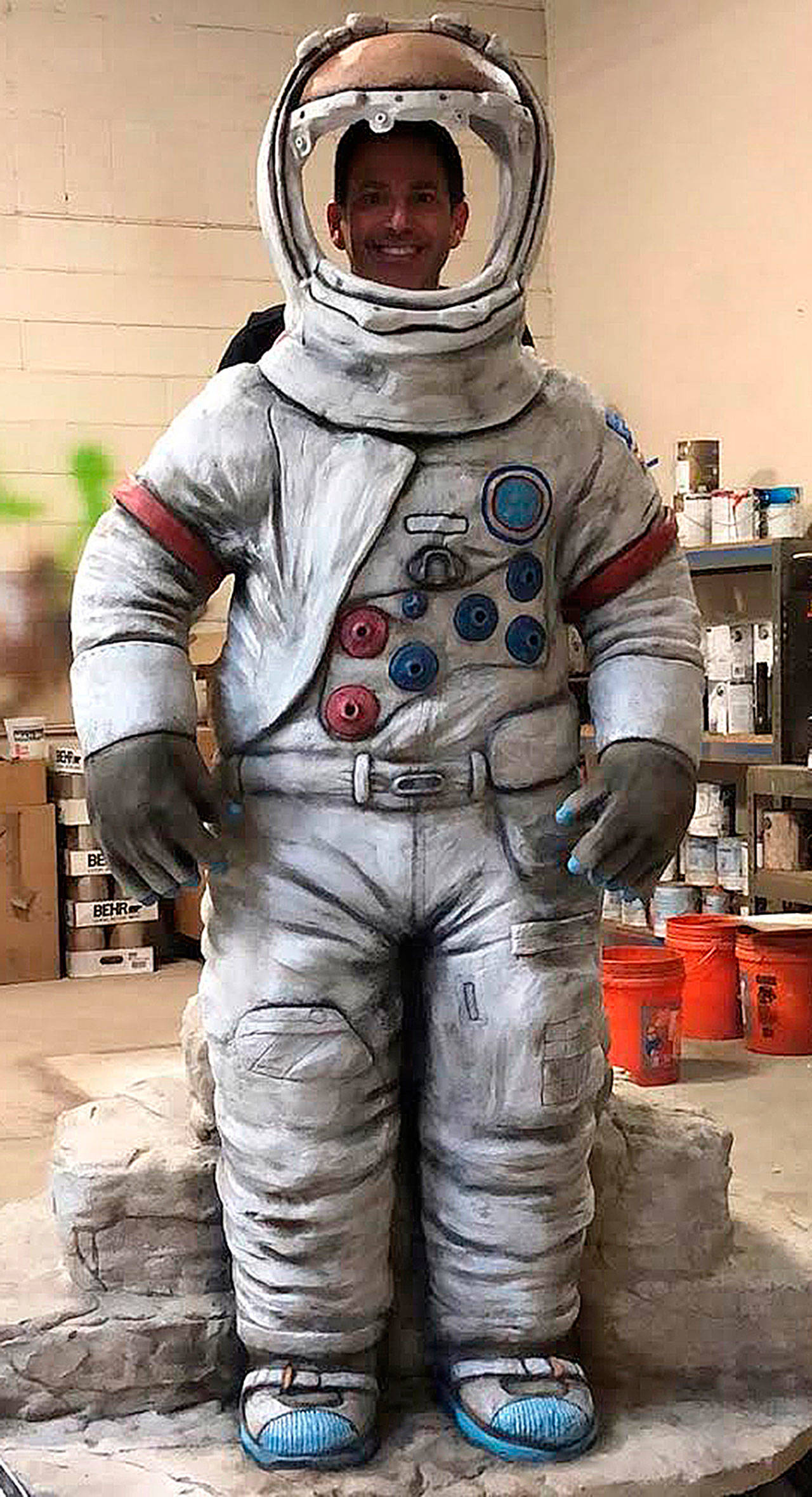 Todd Lehman, of Cre8play, stands behind the astronaut he helped design for a planned lunar rover display in Kent. The astronaut will have a removable face shield. The astronaut will soon go on display at the accesso ShoWare Center to help raise funds for the lunar replica display at a downtown park. COURTESY PHOTO