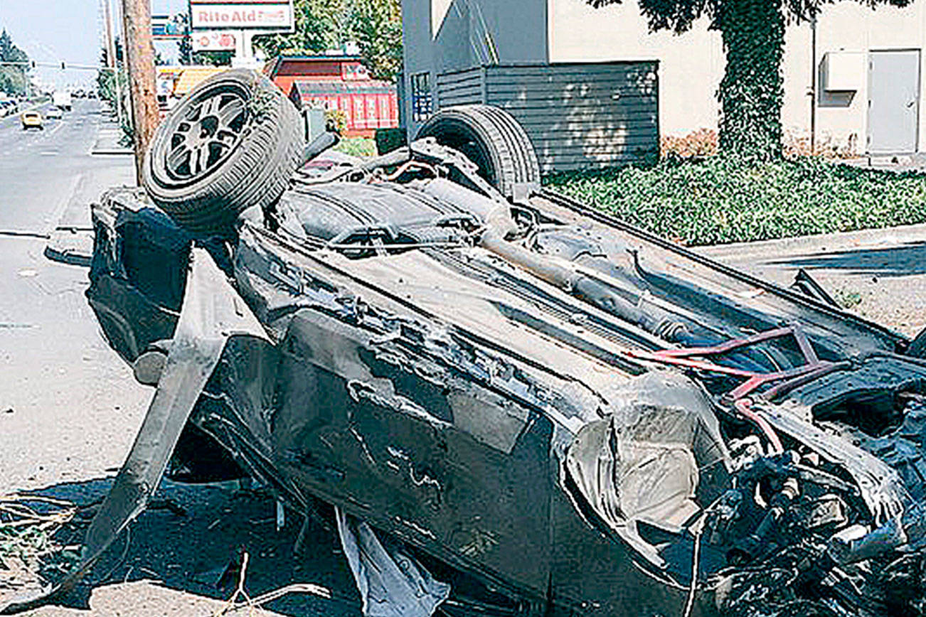 Driver rolls car along Pacific Highway South on Kent’s West Hill