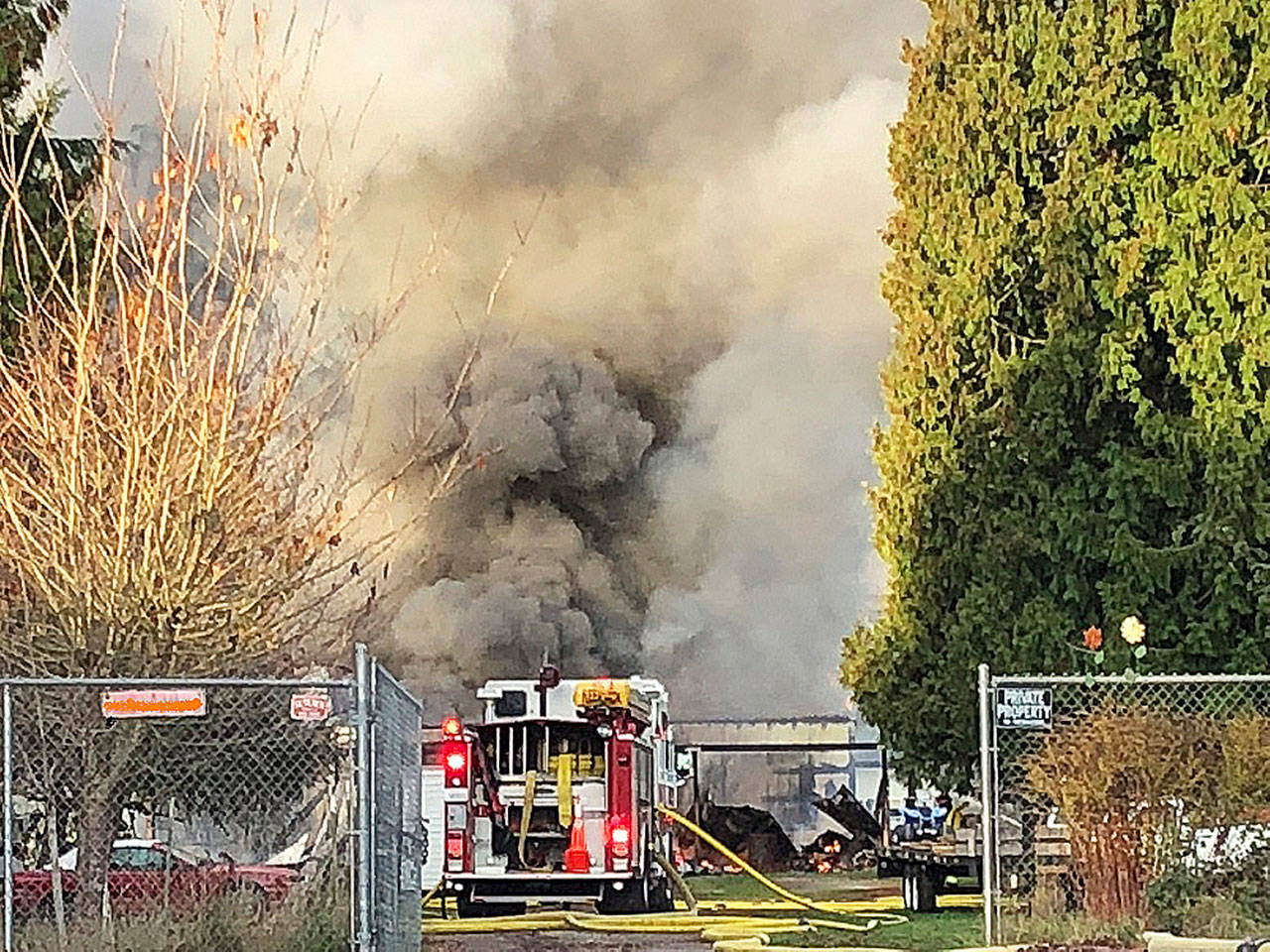 Firefighters battle a blaze early Monday morning at a Kent barn in the 12900 block of Southeast 203rd Place. COURTESY PHOTO, Puget Sound Fire