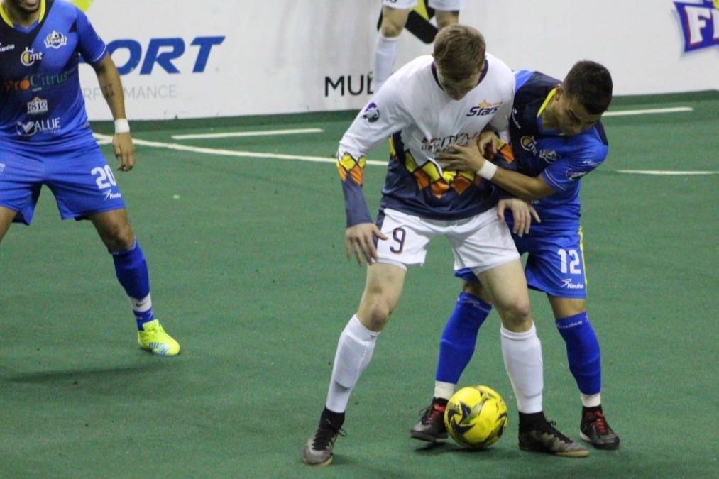 The Stars’ Derek Johnson (9) and a Flash player battle the ball during MASL play Sunday. COURTESY PHOTO, Stars